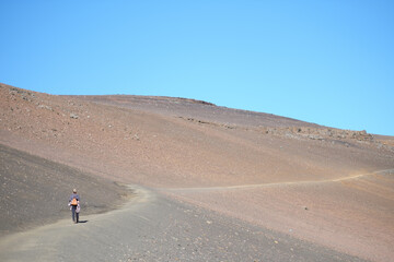 Fototapeta na wymiar a person walking on a desert road