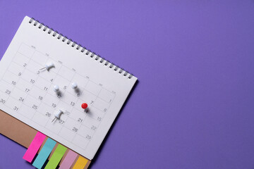 close up of calendar on the purple table background, planning for business meeting or travel...