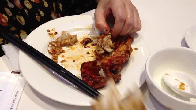 Close Up Woman Eating Lobster On A Plate