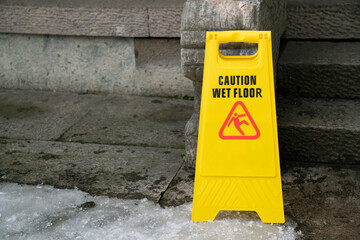 close up warning caution sign for wet slip floor