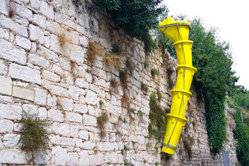 Yellow discharge chute for construction debris