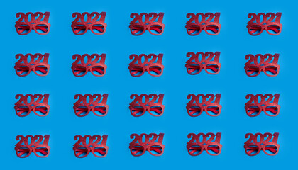 glitter glasses with the year 2021 on a blue background