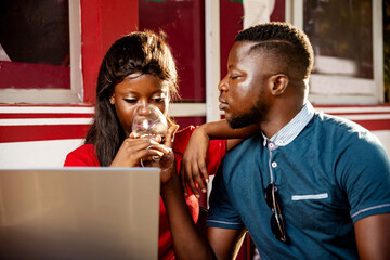 beautiful young couple using a laptop