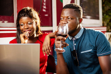 beautiful young couple using a laptop