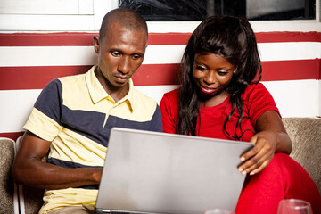 close-up of a young couple with computer at home