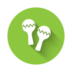 White Maracas icon isolated with long shadow. Music maracas instrument mexico. Green circle button. Vector.