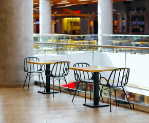 Tables and chairs in cafes in the shopping mall