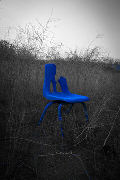 Abandoned Blue Chair in the desert