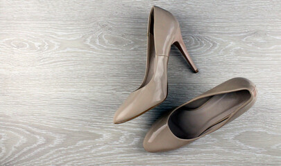 Beige women's shoes on a light background. Women's shoes with heels