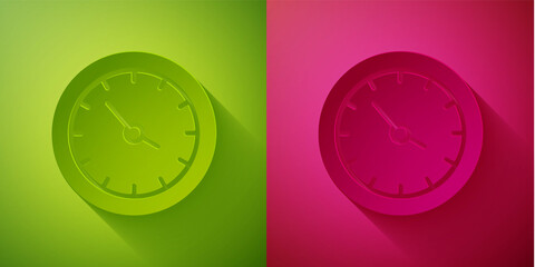 Paper cut Train station clock icon isolated on green and pink background. Paper art style. Vector.
