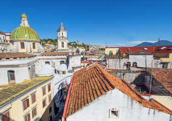 Naples, Italy - located over the Catacombs of San Gaudioso, the Church of Santa Maria della Sanità  is very recognizable for its green dome and Mount Vesuvius on the background