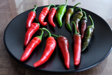 Life cycle of peppers. Stages of red hot pepper growth from green to red. Hot ripen chili peppers without GMO. Nature. Organic Mexican or Turkish spices. It is called 