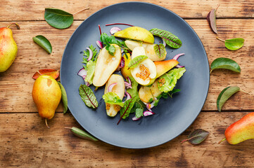Healthy vegetarian salad with pear.