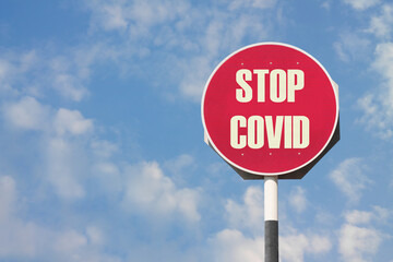 Stop Covid Sign on Red Post
