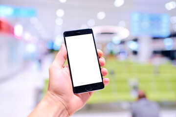Male hand holding smartphone with copy space on the screen.