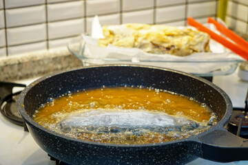 Oil Roasted bonito fish preparation in the kitchen on the oven candid image
