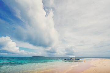 Beautiful landscape with tropical white sand beach with fishing boats. Siargao Island, Philippines.