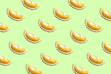 Durian fresh cut pieces as seamless pattern isolated on light green background.