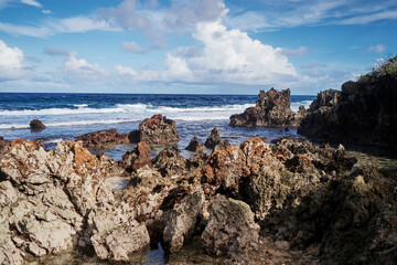 Sea waves and rock stones on the beach.