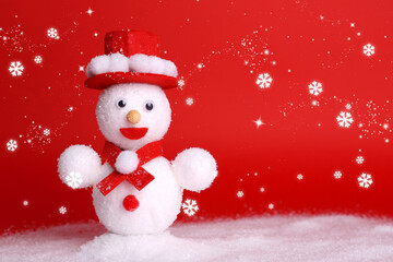 Cute decorative snowman on red background with snowflakes. Space for text