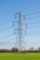 Electricity pylon in a field with blue sky. Bishop's Stortford, Hertfordshire. UK
