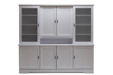 White kitchen cabinet with glass doors. Classical furniture made of natural wood. Modern luxury wooden kitchen isolated on a white background.