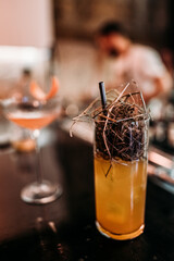 cocktail for a girl and a man stand on the table