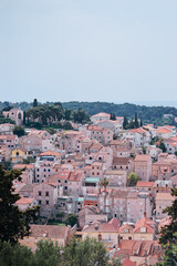 Beautiful cityscape with red tiled roofs of Hvar old town, Croatia.