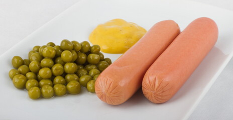 Iron curtain - Two milky boiled sausages, green peas and hot mustard