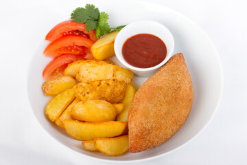 Kiev cutlet with fried potato slices and ketchup