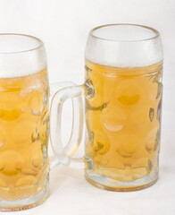 Light wheat beer in glass mugs
