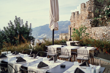 Table in restaurant with sea view in ancient fortress.