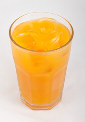 Naklejka na ściany i meble Peach juice with ice cubes in a glass Cup