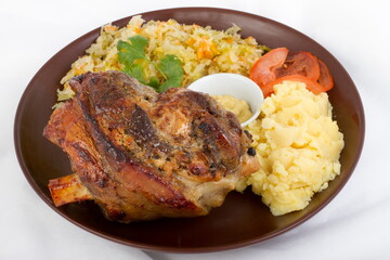 Pork knuckle with mashed potatoes and sauerkraut