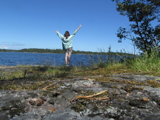 person on the bank of lake