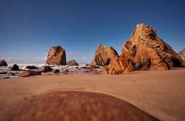 Fototapeta na wymiar Cliffs and rocks on the Atlantic ocean coast - Praia da Ursa beach, Portugal.