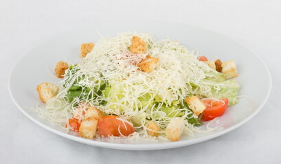 Classic Caesar salad on a white plate