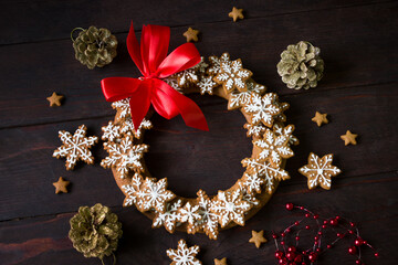 Obraz na płótnie Canvas Christmas wreath made of homemade cookies .Christmas hand-painted gingerbread cookies. Christmas background