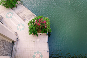 Top view of tiled promenade near the lake.