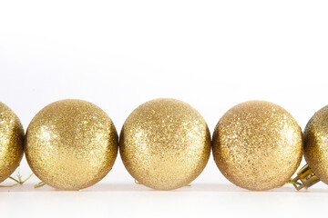 Golden Christmas balls isolated on a white background