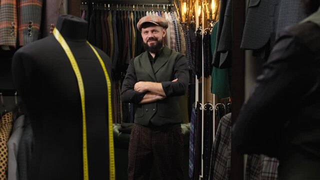 Bearded tailor portrait. Creative stylist portrait. Handmade costume designer works in his store. Fashion, small business concept 4k