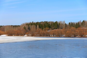 landscape with lake and melting ice