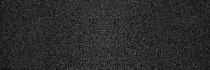 Surface texture of grey and black fresh asphalt pavement on street roads. Abstract panoramic...