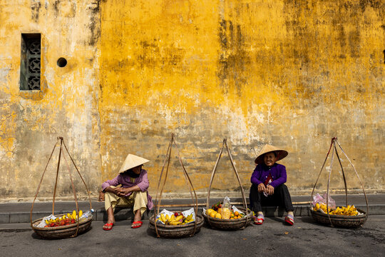 Old Woman from Vietnam is selling fruits in the Streets of Hoi An	