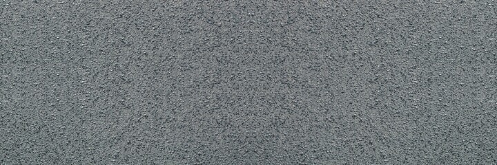 Surface texture of grey and black fresh asphalt pavement on street roads. Abstract panoramic background
