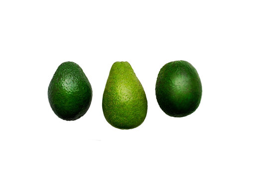 Avocado isolated on white. Three fruits. Different varieties of avocado.Photo suitable for advertising and packaging.