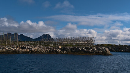 Wooden drying flakes for preservation of traditional stockfish in the harbor of Svolvær,...