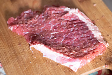 Broken piece of raw meat