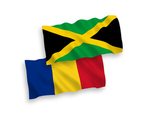 National vector fabric wave flags of Romania and Jamaica isolated on white background. 1 to 2 proportion.