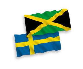 National vector fabric wave flags of Sweden and Jamaica isolated on white background. 1 to 2 proportion.